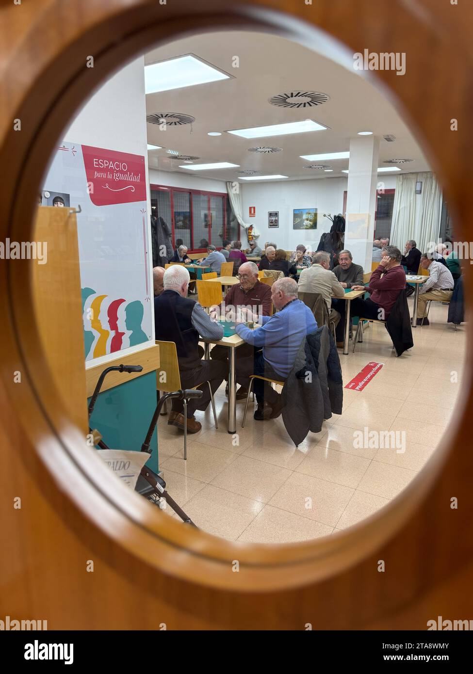 Elderly people playing cards at Isaac Valero Civic Center of Zaragoza, Spain Stock Photo