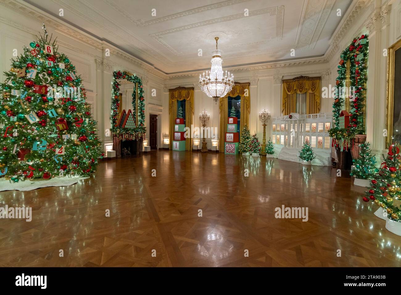 Washington, United States. 26th Nov, 2023. The East Room decorated with Christmas Trees as part of the decorations at the annual White House Christmas, November 28, 2023 in Washington, DC The theme is “Magic, Wonder and Joy,” and will welcome approximately 100,000 visitors during the holiday season. Credit: Katie Ricks/White House Photo/Alamy Live News Stock Photo