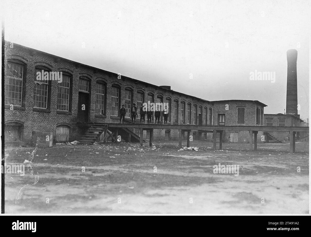 View of the Scotland Mills. All these boys work in mill. Laurinburg, N.C. Stock Photo