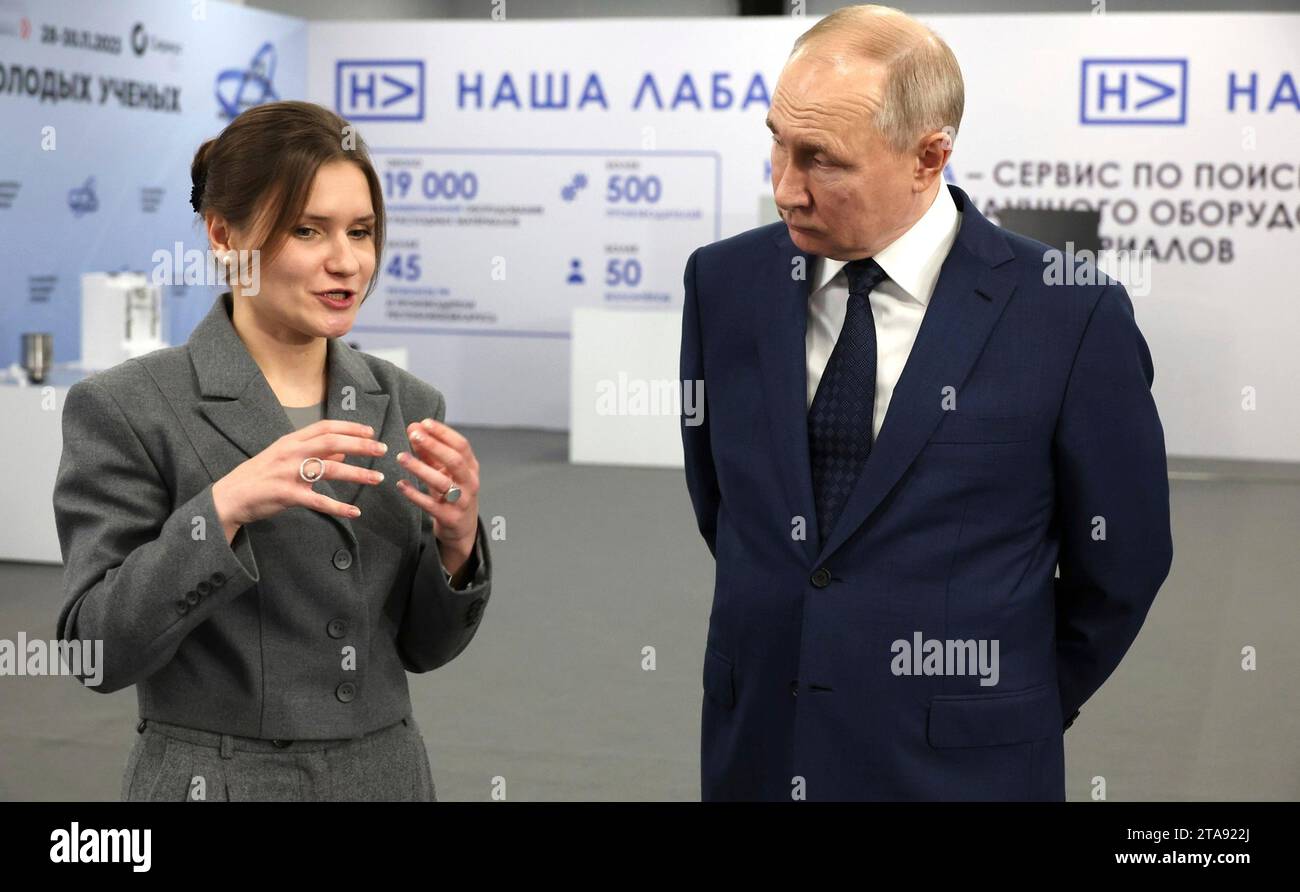 Sochi, Russia. 29th Nov, 2023. Russian President Vladimir Putin, right, is shown items in the Nasha Laba project by MIPT senior researcher Elizaveta Mochalova, left, before a meeting of the Congress of Young Scientists, November 29, 2023 in Sochi, Russia. Credit: Mikhail Klimentyev/Kremlin Pool/Alamy Live News Stock Photo