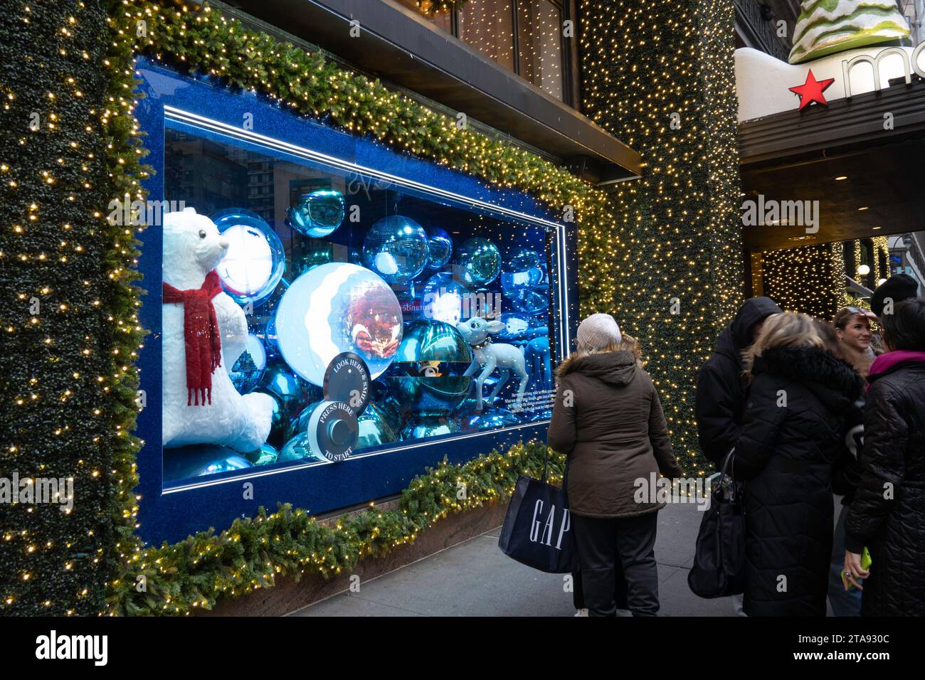 Macy's holiday windows are always a popular tourist stop in Herald Square, New York City, USA  2023 Stock Photo