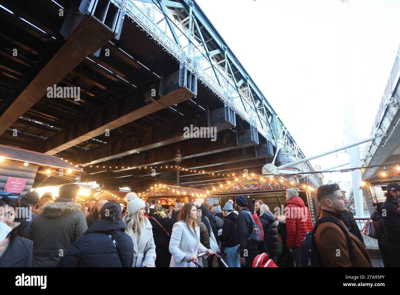 The food chalets of the Southbank Centre Winter market for Christmas 2023, under Hungerford
