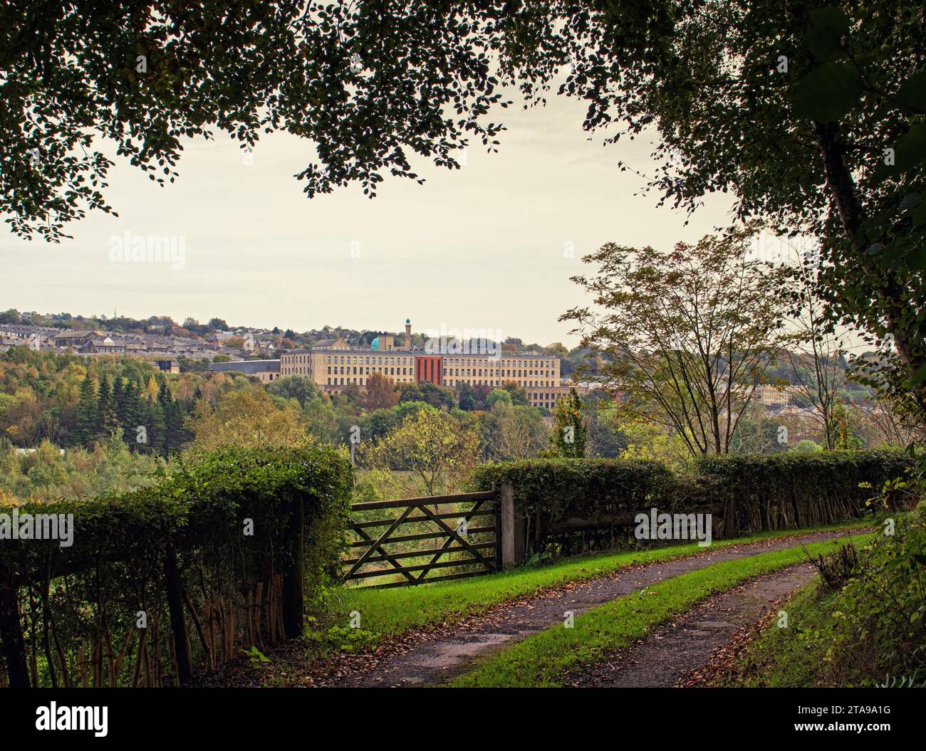 Distant Brierfield, viewed from the local countryside, with the renovated Tunstill mill as the focal point Stock Photo