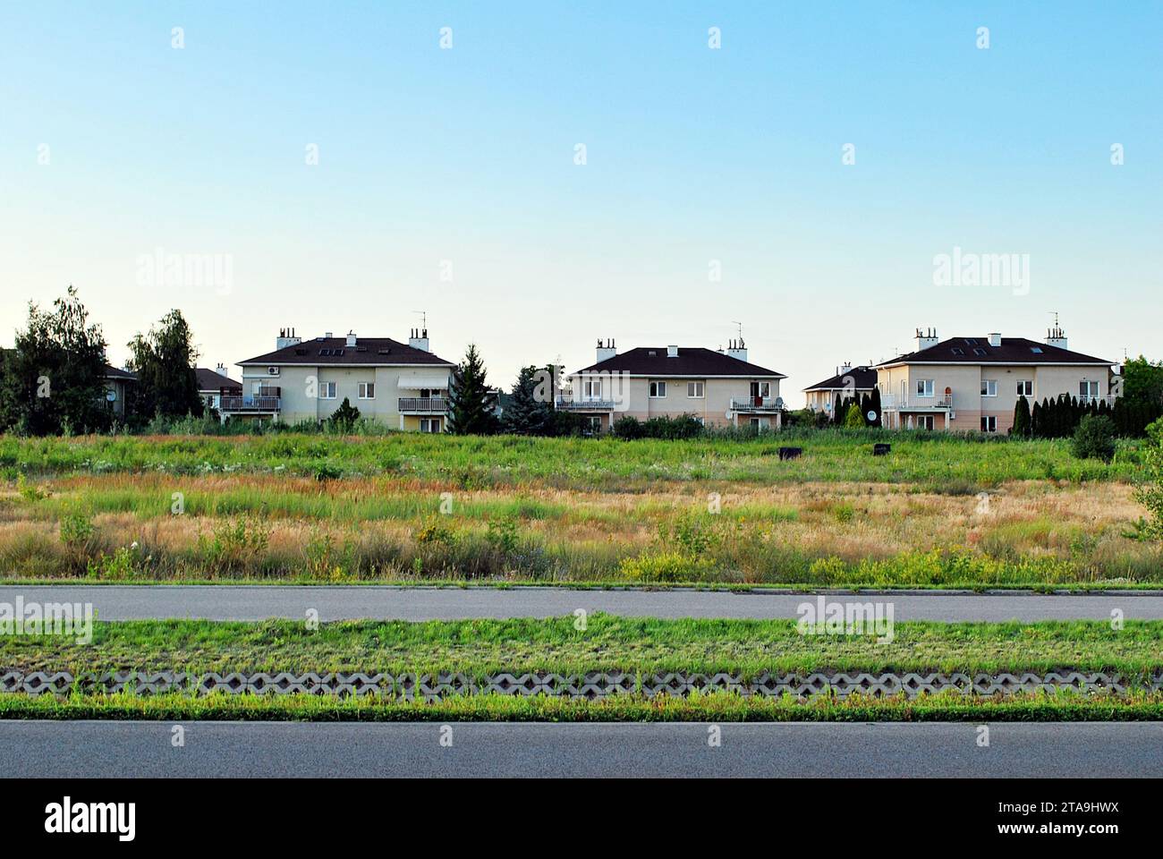 New single family house in a new development area. Residential home with modern facade. Stock Photo