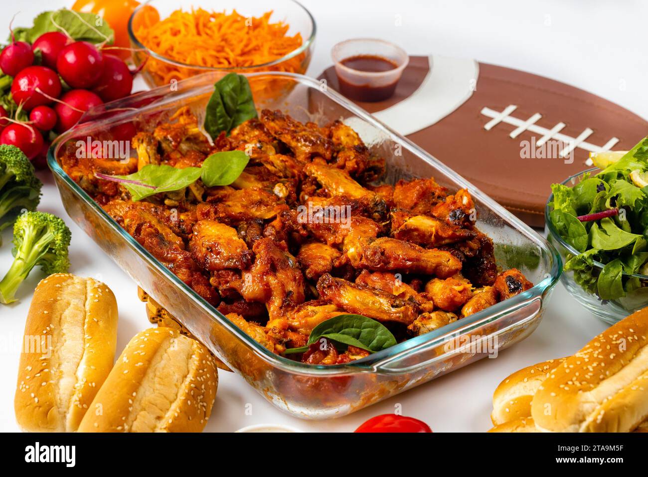 During big game, American football fans can enjoy food catering. Stock Photo