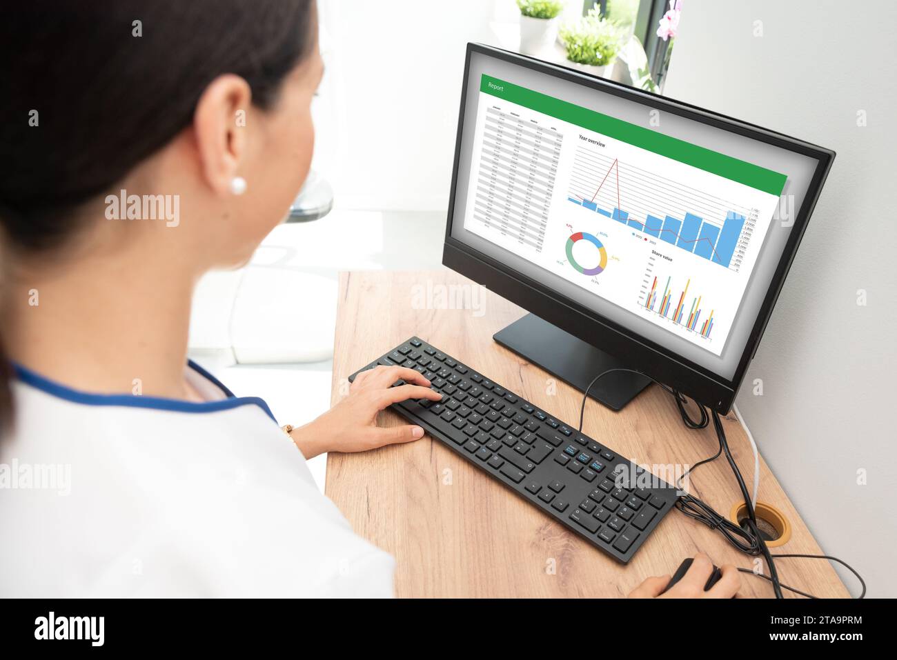 Woman analyzing data for marketing plan. Business analytics, spreadsheet Stock Photo