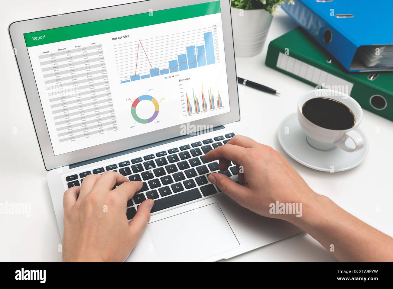 Analyst uses spreadsheet for calculations. Workplace closeup Stock Photo