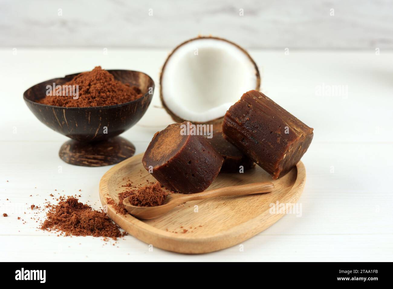 Granular and Block Shape of Prganic Brown Palm Dugar or Coconut Sugar made from Coconut Juice. On White Background Stock Photo
