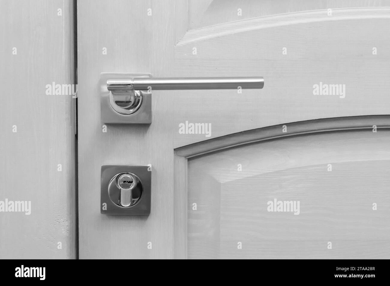 White Wooden Door Metal Handle Element Design Interior Detail Close-Up. Stock Photo