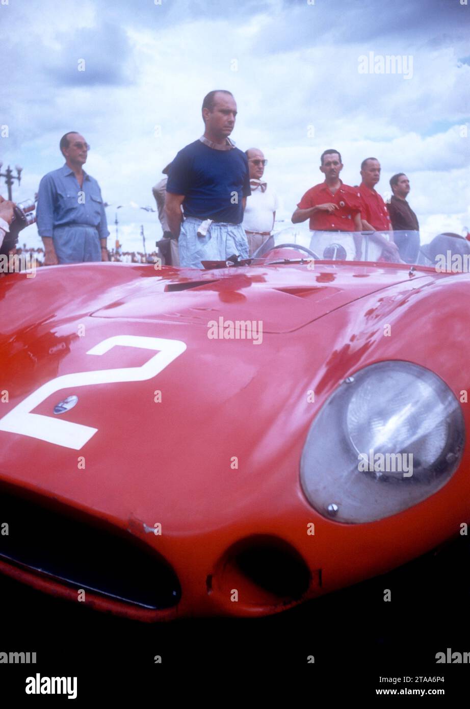 HAVANA, CUBA - FEBRUARY 24:  Juan Manuel Fangio (1911-1995) driver of the Maserati 300S stands next to his car after the 1957 Cuban Grand Prix on February 24, 1957 in Havana, Cuba.  Fangio won the race.  (Photo by Hy Peskin) *** Local Caption *** Juan Manuel Fangio Stock Photo