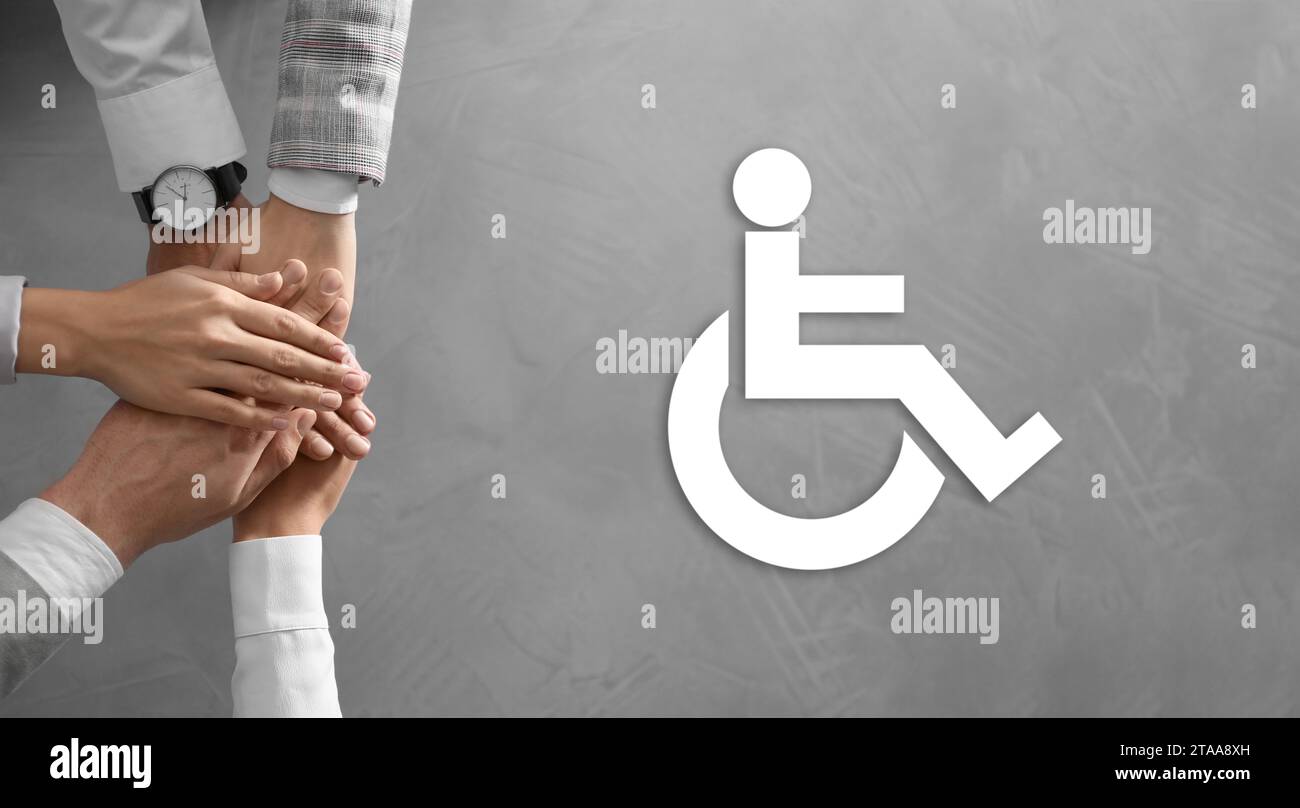 Inclusive workplace culture, banner design. International symbol of access. People holding hands together, top view Stock Photo