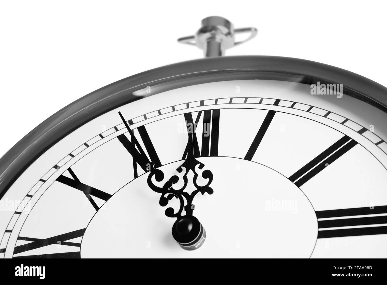Clock showing five minutes until midnight on white background, closeup