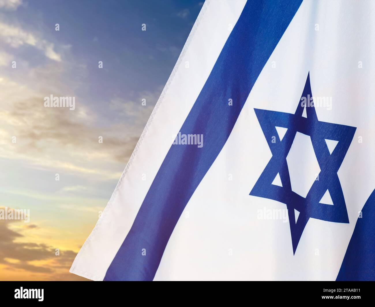 National flag of Israel against blue sky with clouds Stock Photo - Alamy
