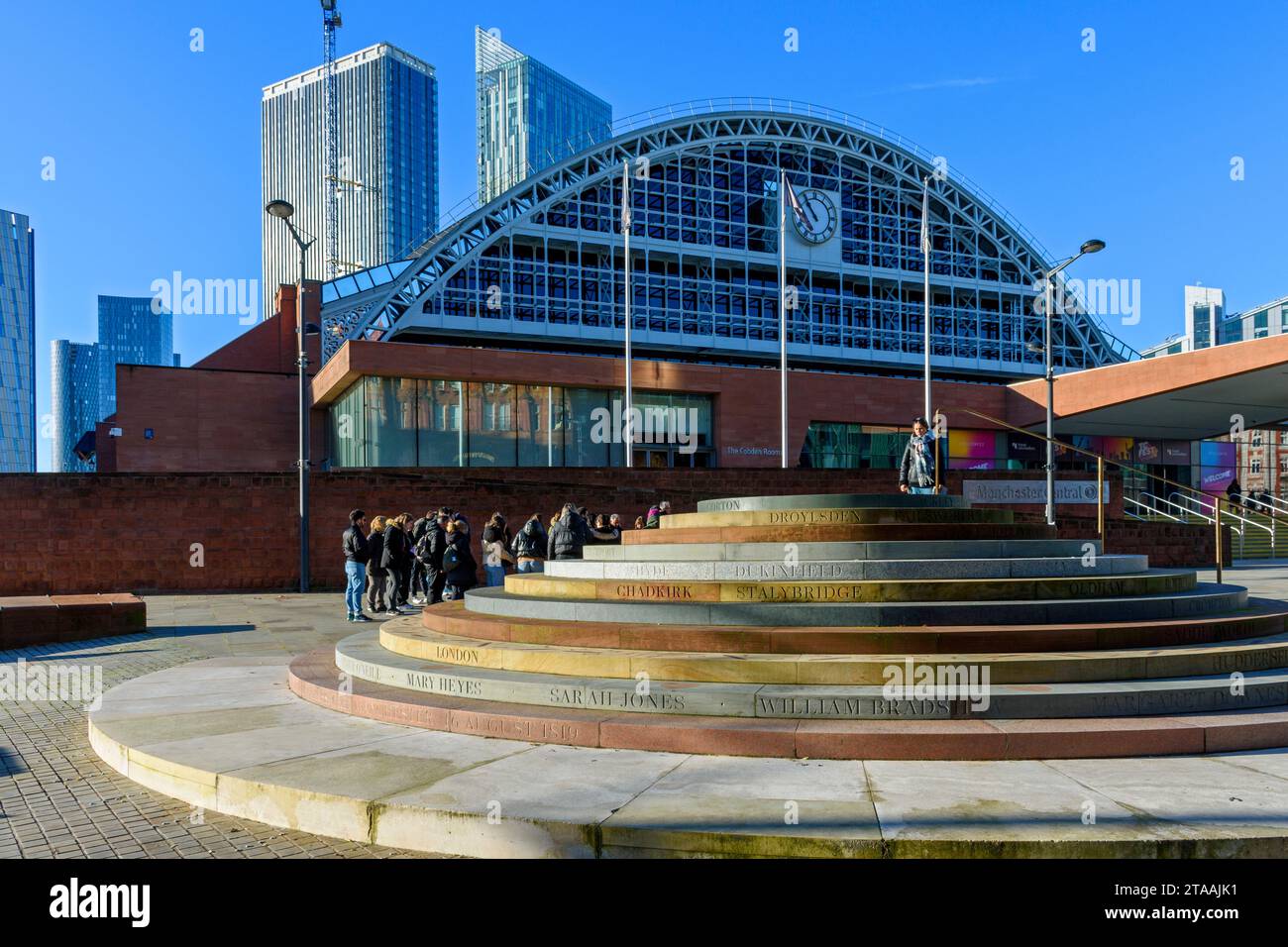The Peterloo Massacre memorial, designed by Jeremy Deller, outside the Manchester Central building, Manchester UK. The Viadux and Beetham Tower behind Stock Photo