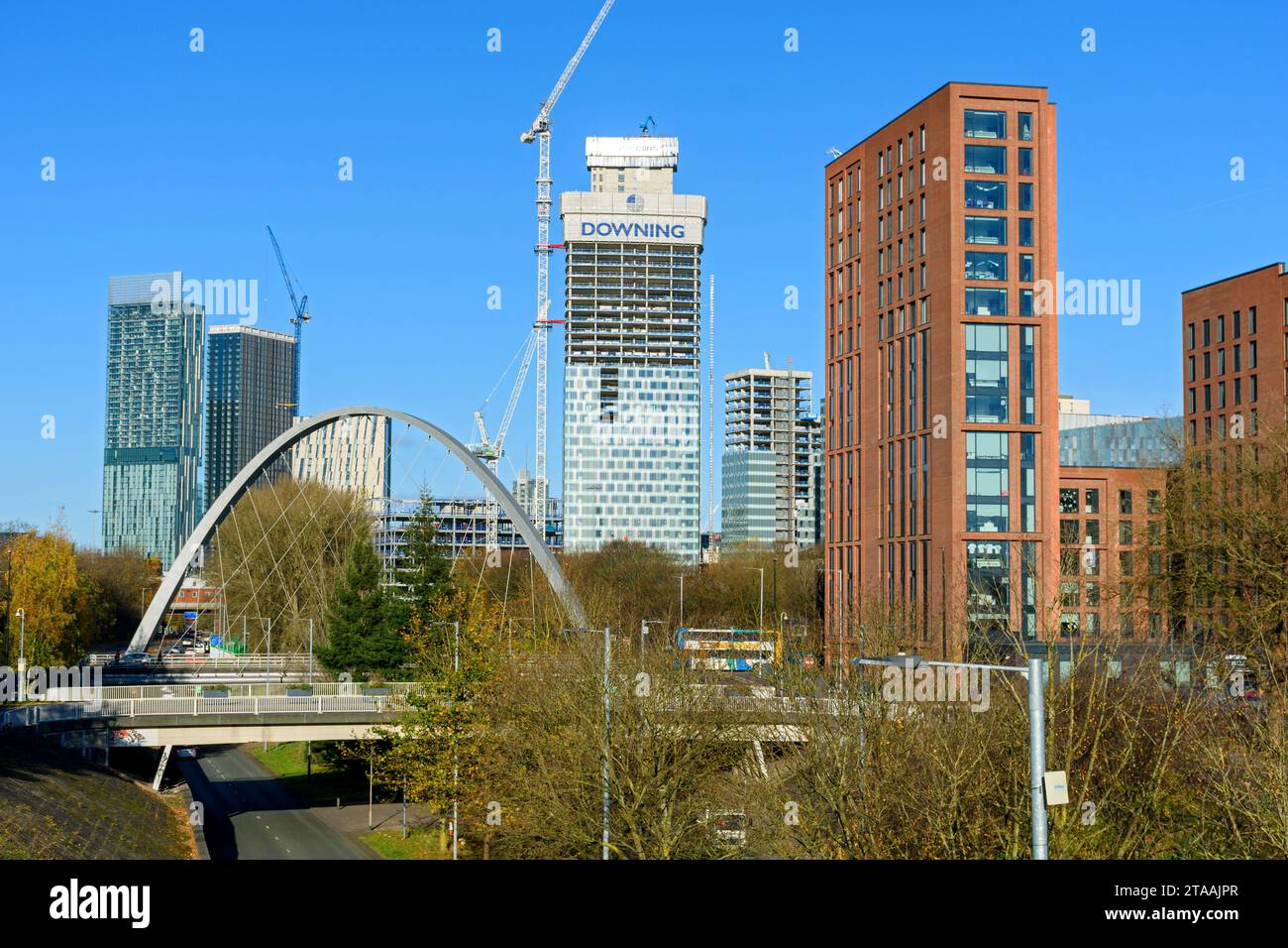 The Beetham Tower, Axis Tower, Square Gardens (under construction) and Archway apartment blocks over the Hulme Arch bridge, Manchester, England, UK Stock Photo