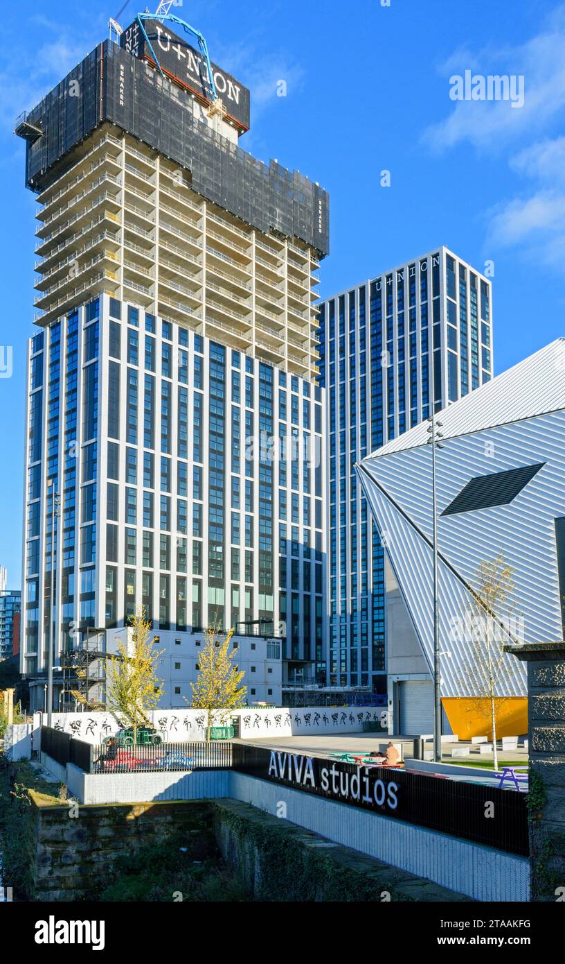 The U+nion (Union) apartment block under construction next to the Aviva Studios arts centre, Manchester, UK.  Architects: Denton Corker Marshall. Stock Photo