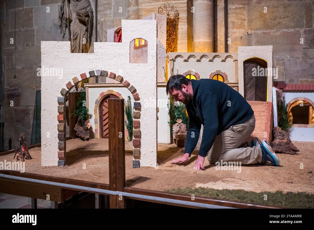 Bamberg germany 29th nov 2023 dirk hirsch spreads sand on the floor