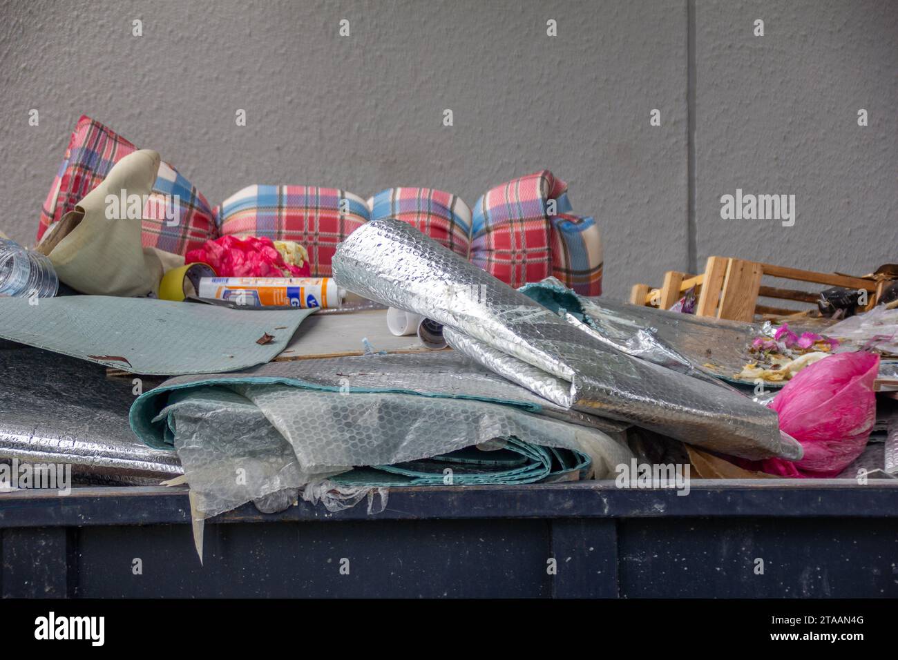 A large trash bin with full of trash Stock Photo Alamy