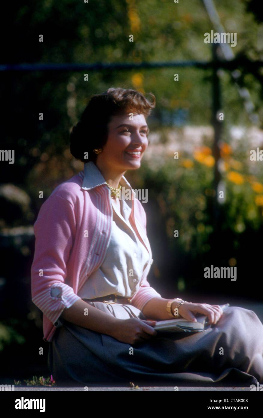 MARCH, 1955:  American film and television actress Donna Reed (1921-1986) poses for a portrait in a convertible circa March, 1955.  (Photo by Hy Peskin) *** Local Caption *** Donna Reed Stock Photo