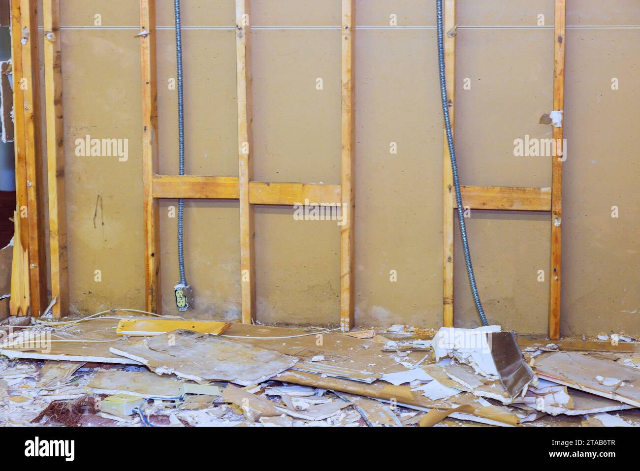 During house renovation, process of removing old, damaged plasterboard