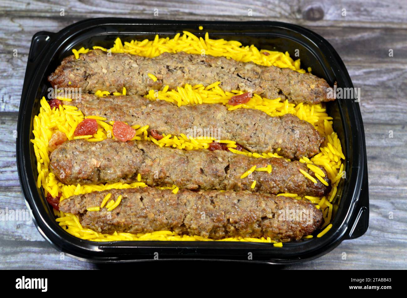 Arabic cuisine traditional food beef  Kofta, kebab and tarb kofta shish which is minced meat with Basmati rice and raisins, oriental grilled barbecued Stock Photo