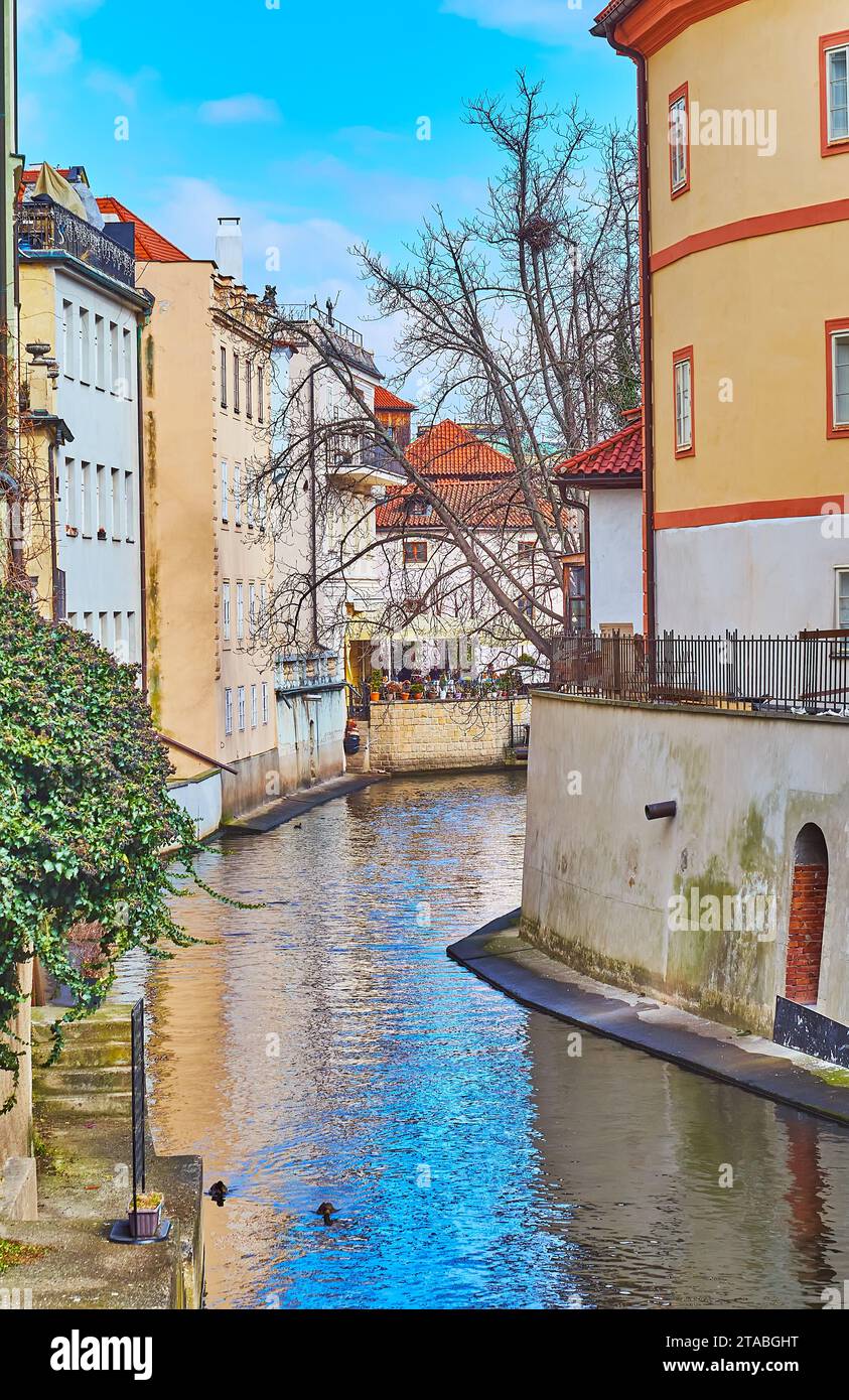 The narrow curved Devil's Canal, lined with historic houses, Mala Strana, Prague, Czechia Stock Photo