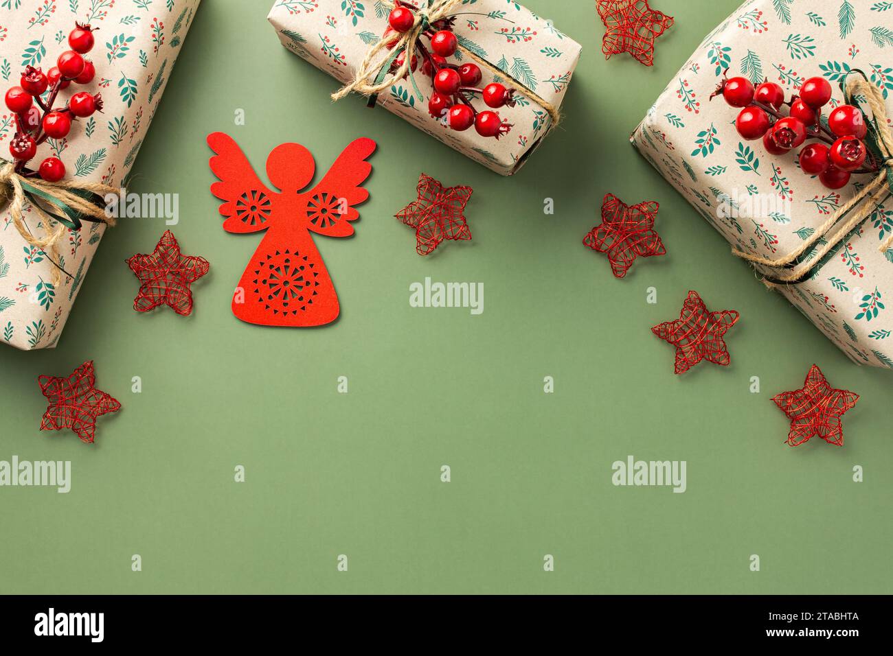 Flat-lay of festive craft gift boxes in wrapping paper decorated with green  and red ribbon bows over plain white background, top view, horizontal  composition. Christmas boxing day concept Stock Photo - Alamy