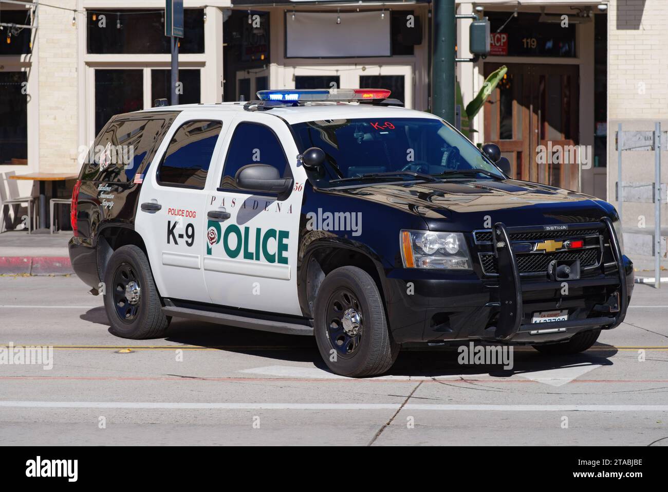 Pasadena Police Department vehicle, K-9 Dog Unit, shown stationary on a street blocking traffic. Stock Photo
