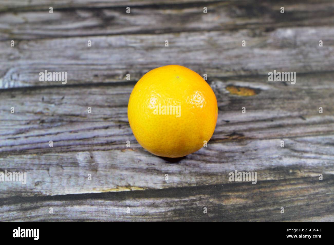 fresh yellow lemon, The lemon (Citrus limon) is a species of small evergreen trees in the flowering plant family Rutaceae, native to Asia, used in rec Stock Photo
