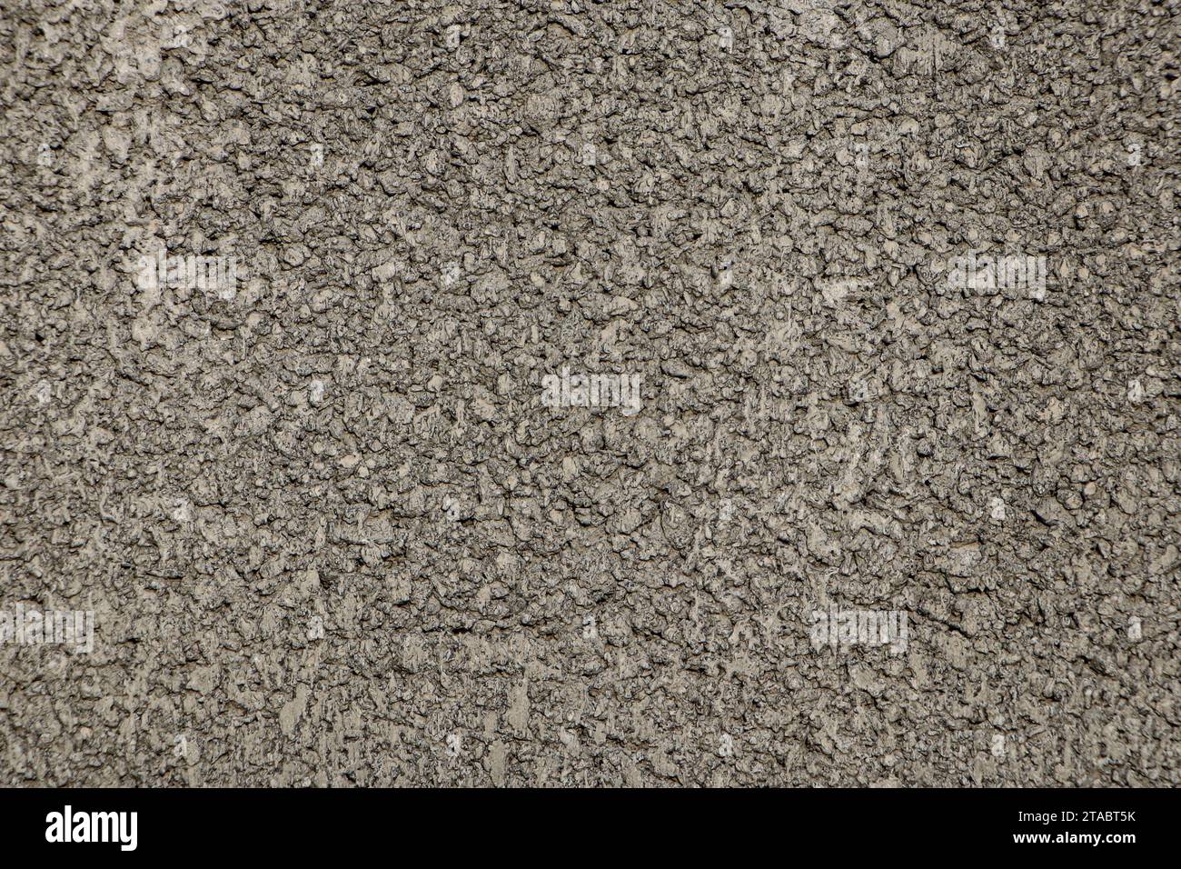 Close-up shot of a cement wall intentionally roughening the surface to create a wall fence. Stock Photo