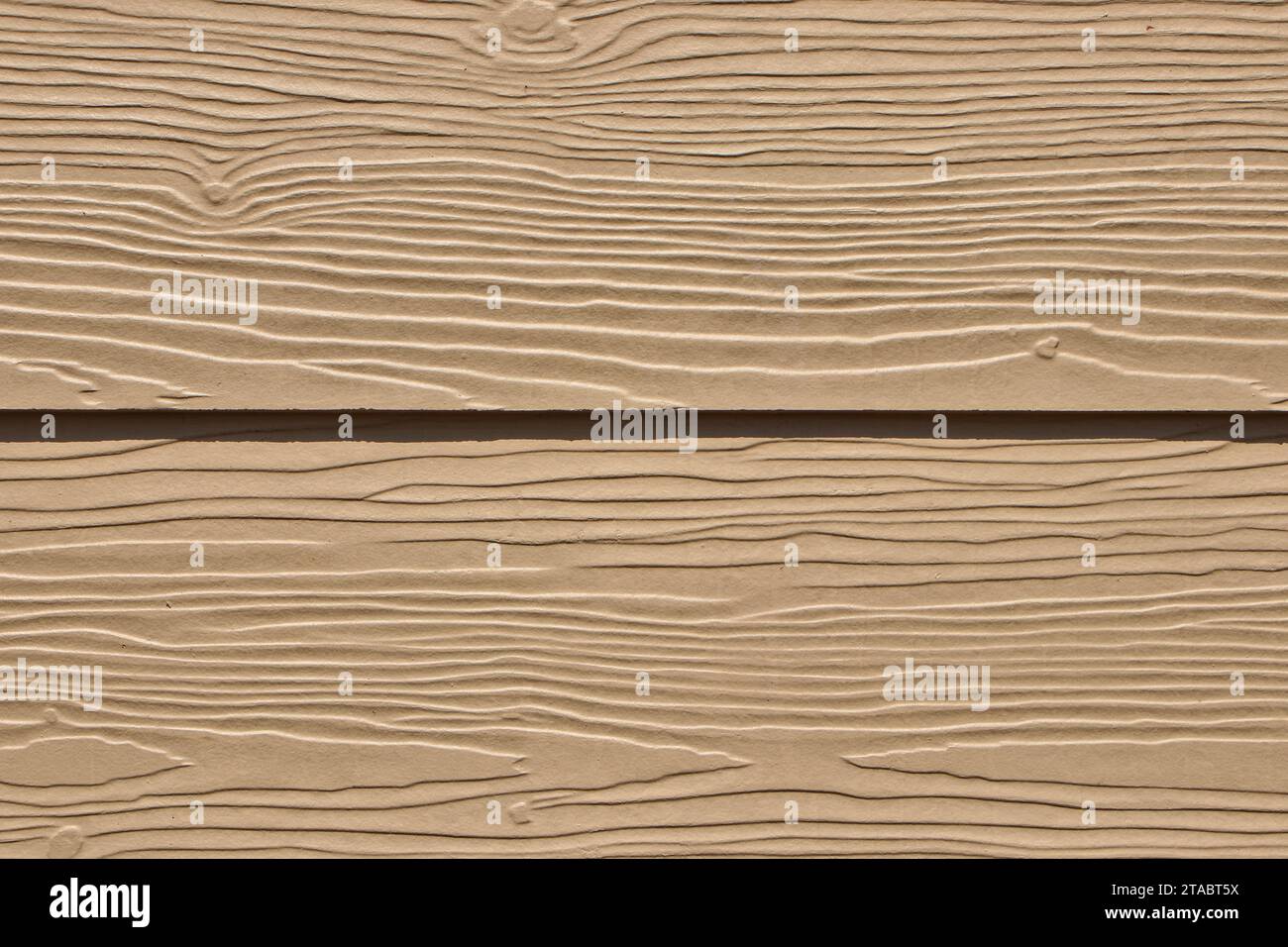 Artificial wood walls receive natural light during the day, showing texture details. Stock Photo