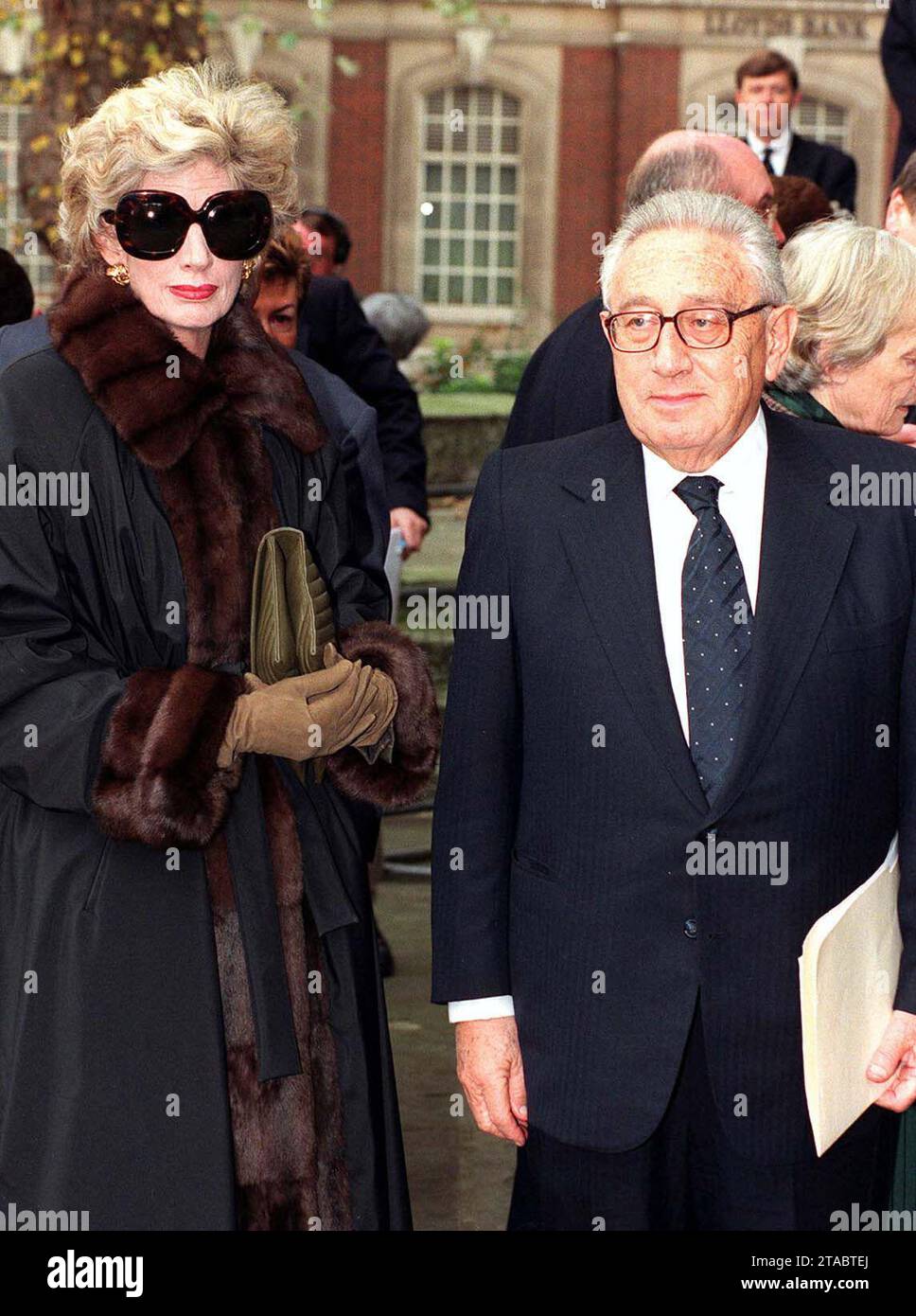 File photo dated 13/11/1997 of former US Secretary of State Henry Kissinger with his wife Nancy arrive at the private memorial service for the late Sir James Goldsmith at St John's Concert Hall, Westminster. Kissinger, the US secretary of state who dominated foreign policy under former presidents Richard Nixon and Gerald Ford, has died aged 100, his consulting firm Kissinger Associates said. Issue date: Thursday November 30, 2023. Stock Photo
