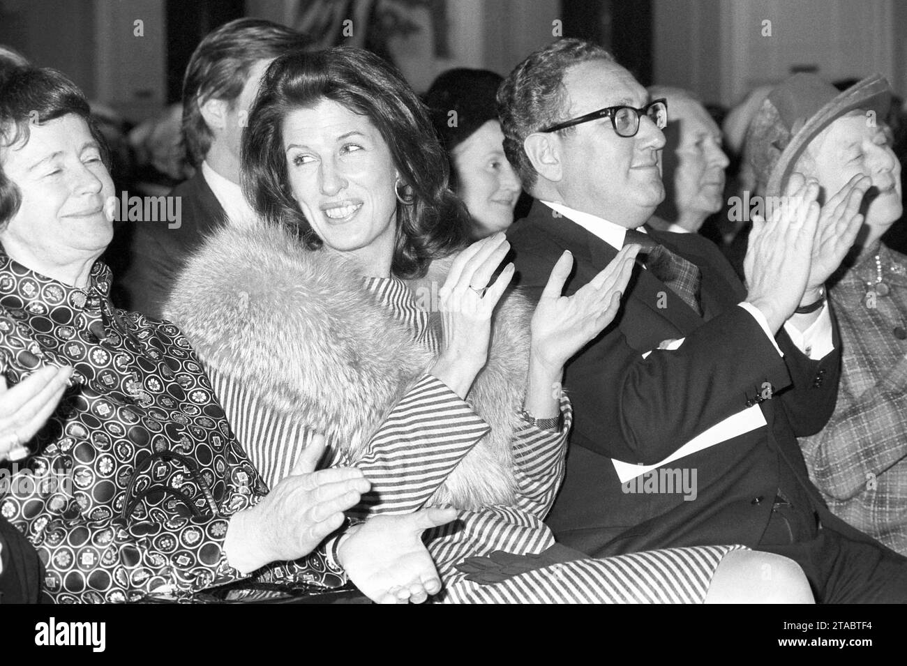 File photo dated 6/3/1975 of United States Secretary of State, Dr Henry Kissinger and his wife, Nancy, applaud as Foreign Secretary, Mr James Callaghan receives the Freedom of Cardiff in a City Hall ceremony. Kissinger, the US secretary of state who dominated foreign policy under former presidents Richard Nixon and Gerald Ford, has died aged 100, his consulting firm Kissinger Associates said. Issue date: Thursday November 30, 2023. Stock Photo