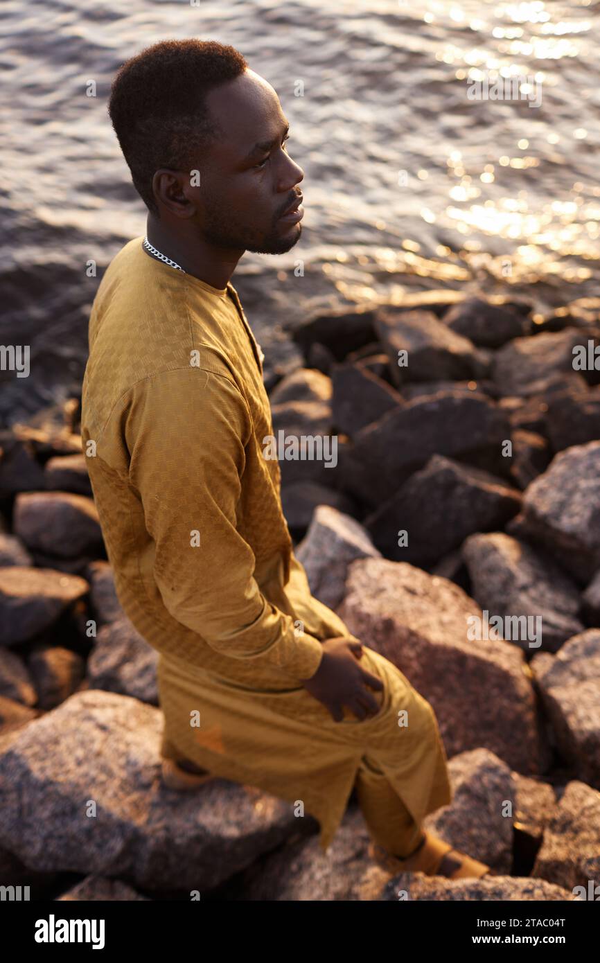 Man sitting sea shore hi-res stock photography and images - Alamy
