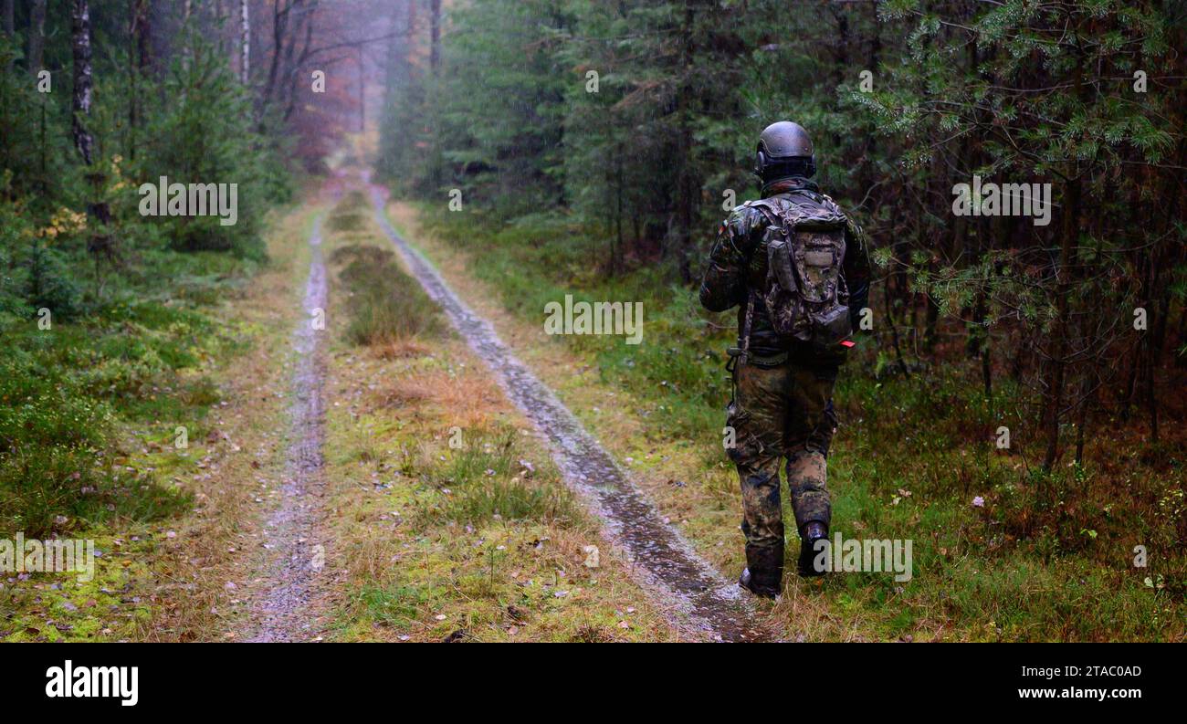 Breitenhees, Germany. 20th Nov, 2023. A Bundeswehr soldier walks ...