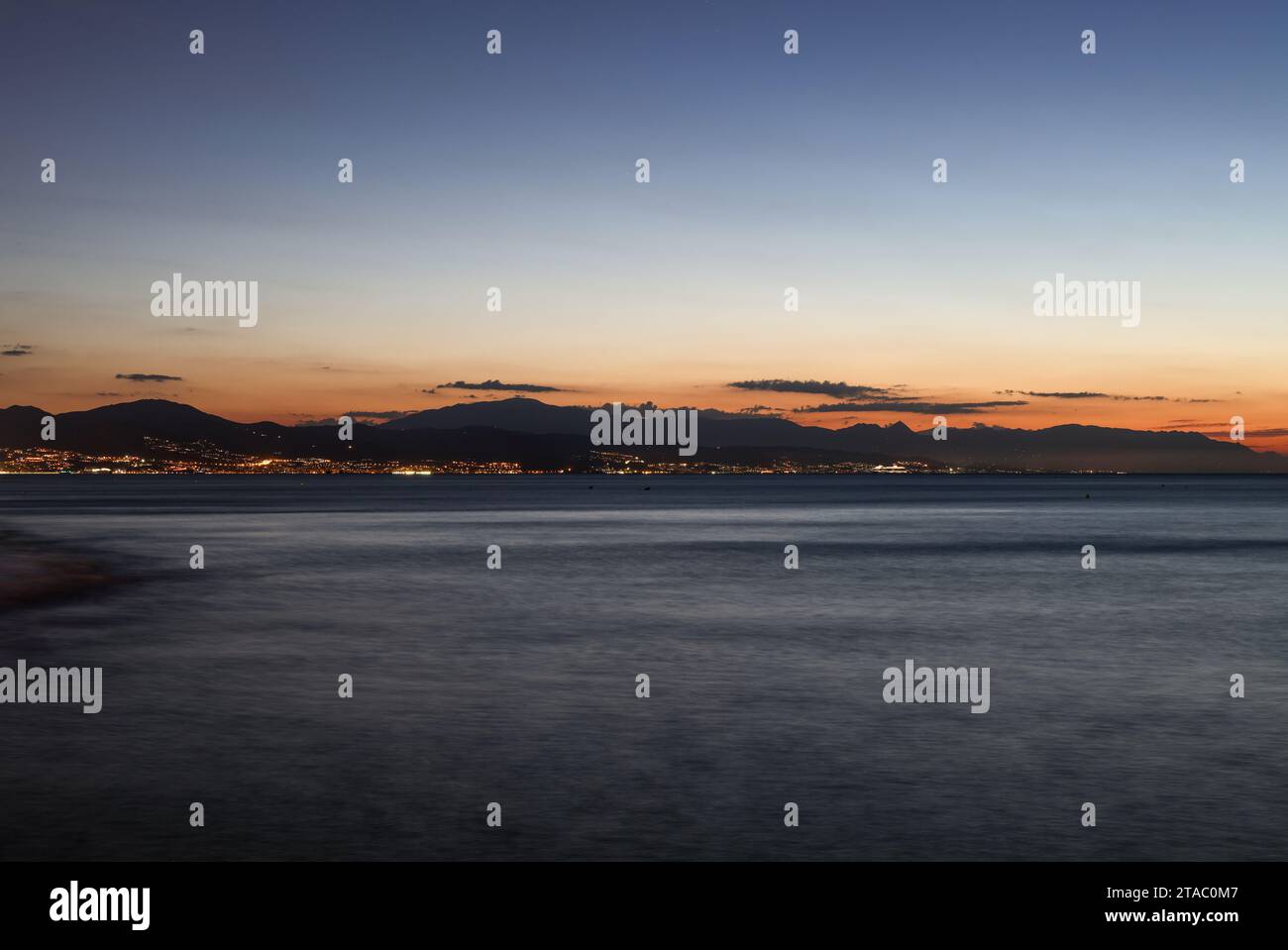 View from Torremolinos towards Malaga just before sunrise. Costa del Sol, Spain. Stock Photo
