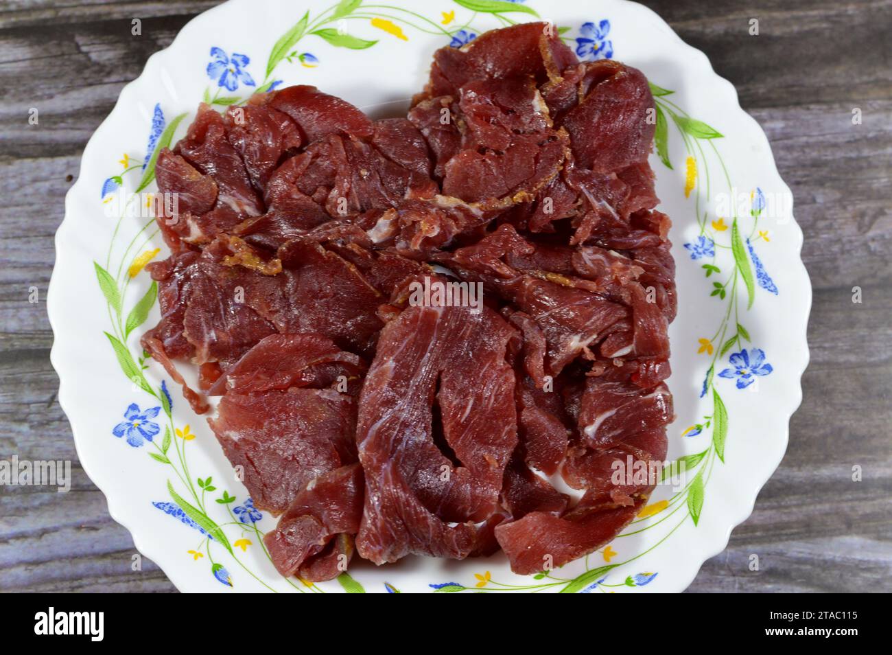 Thin slices of beef pastrami, made from beef brisket, raw meat is