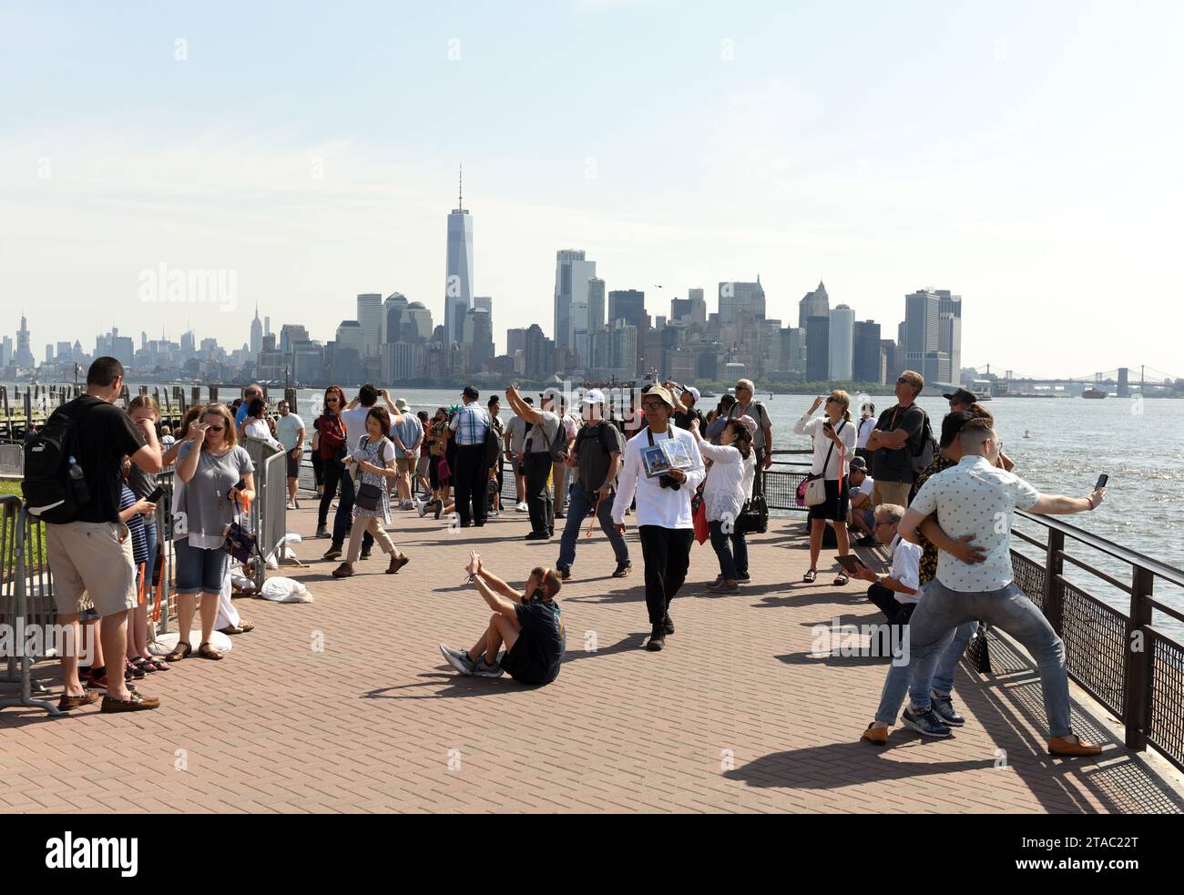 New York, USA - June 09, 2018: Crowd of people near the  Statue of Liberty. Stock Photo