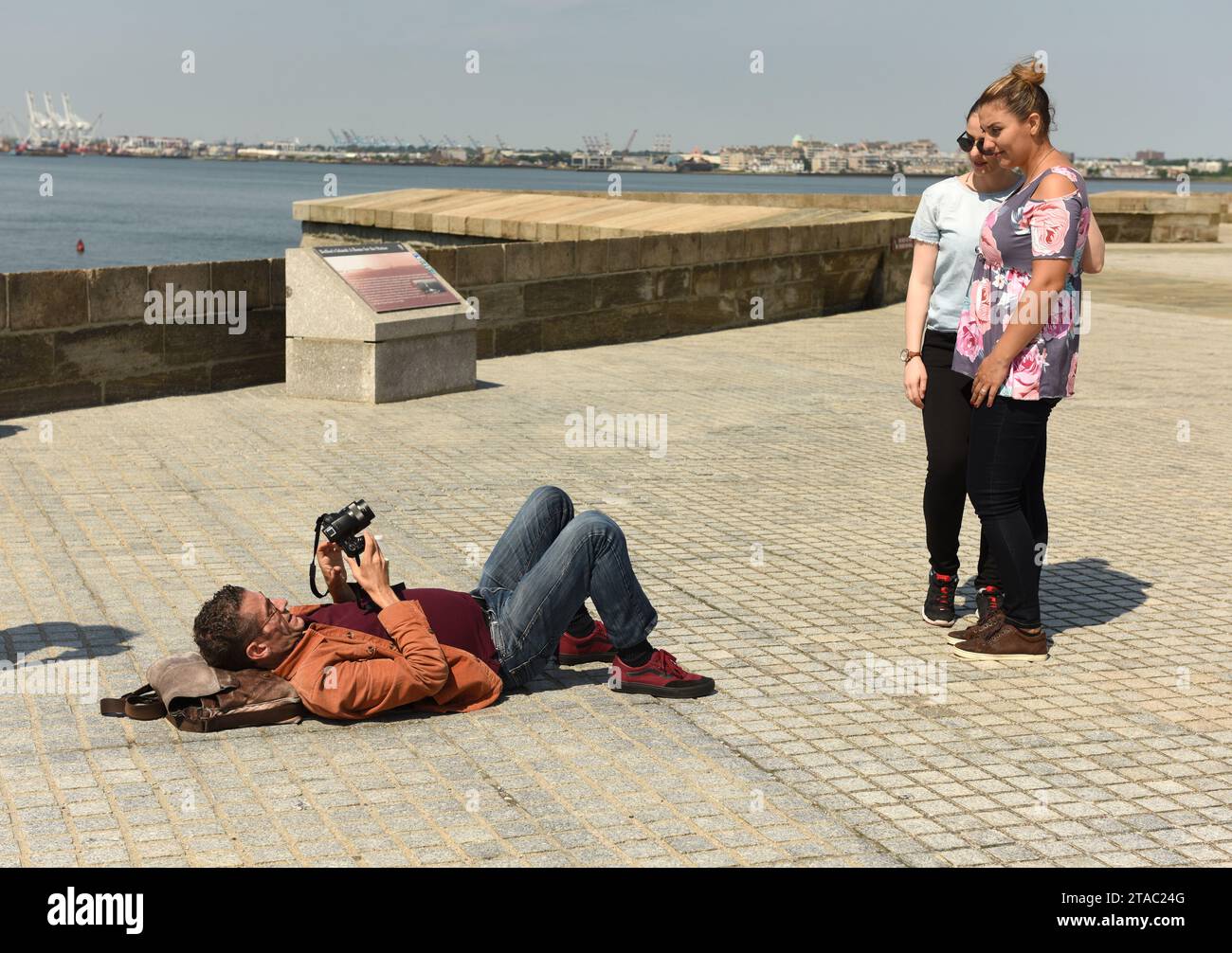 New York, USA - June 09, 2018: Tourists make a pictures near the Statue of Liberty. Stock Photo