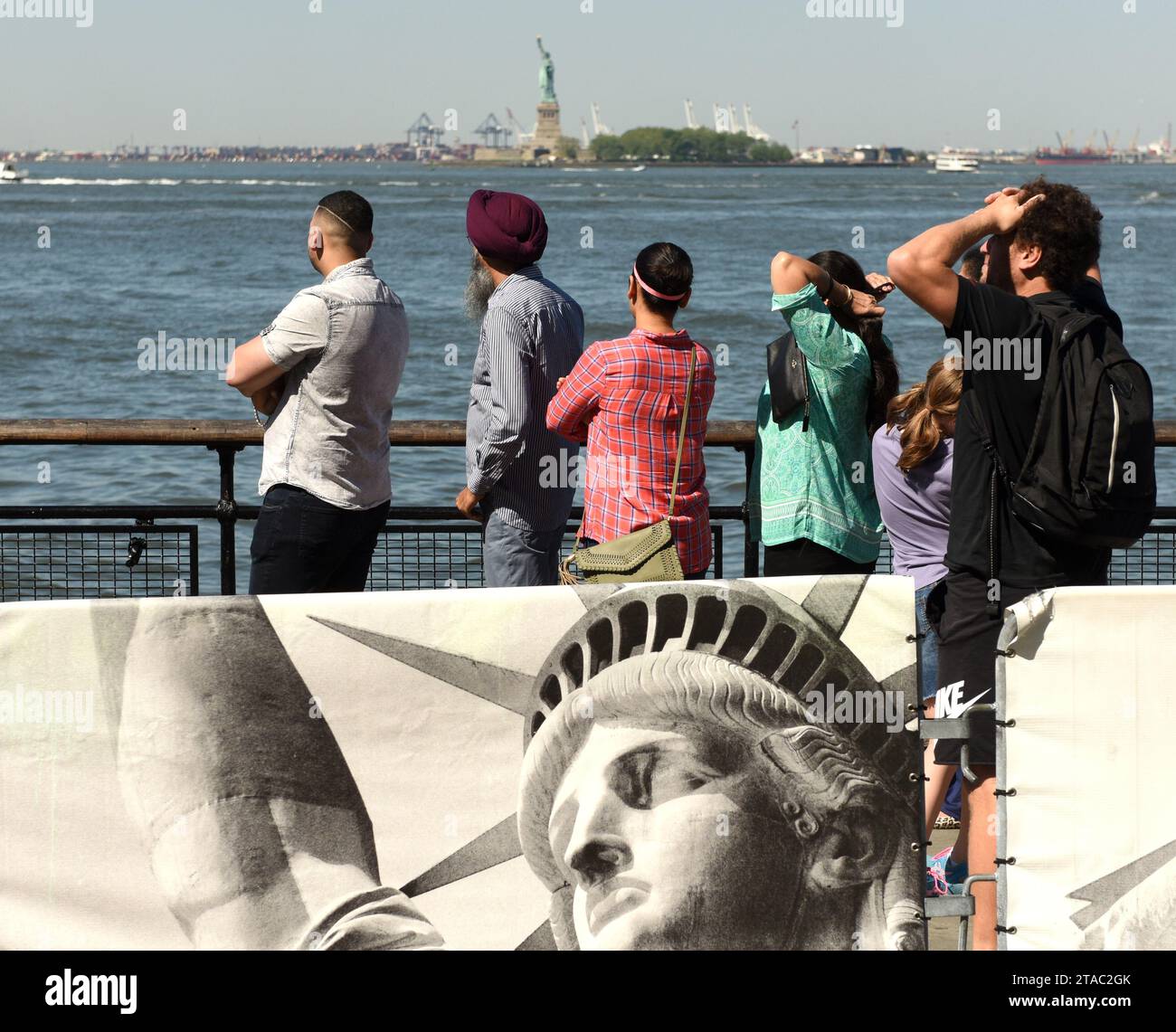New York, USA - May 24, 2018: People waiting for the ferry of Statue Cruises in order to Visit the Statue of Liberty and  Ellis Island. Stock Photo