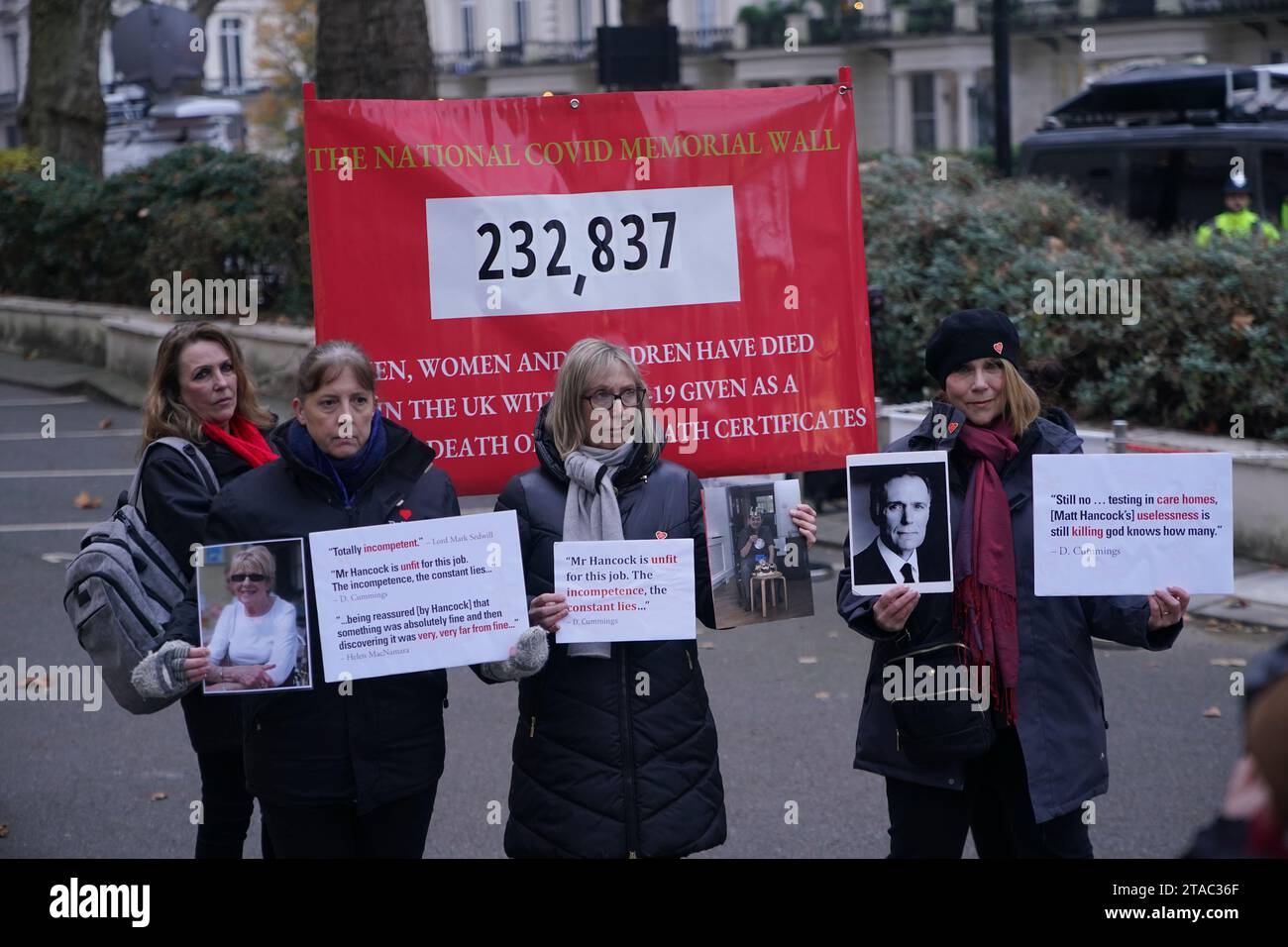 Protesters wait outside the UK Covid-19 Inquiry at Dorland House in ...