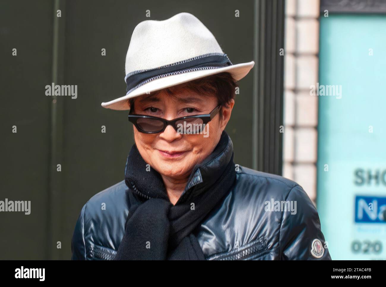 Who's that girl?   Yoko Ono - spotted walking in Green Park area today unnoticed by crowd enjoyed the spring sunshine. 17.3.10  She wore white panama Stock Photo