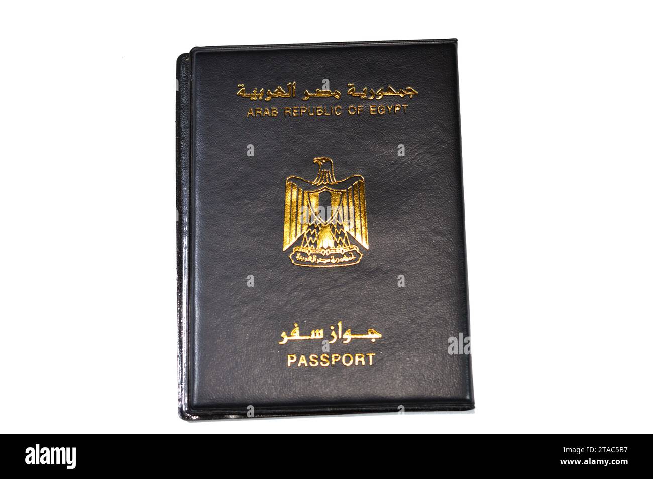 Egyptian passport black book, Translation of Arabic words (Arab republic of Egypt's passport) with the republican golden eagle on its cover, A black p Stock Photo