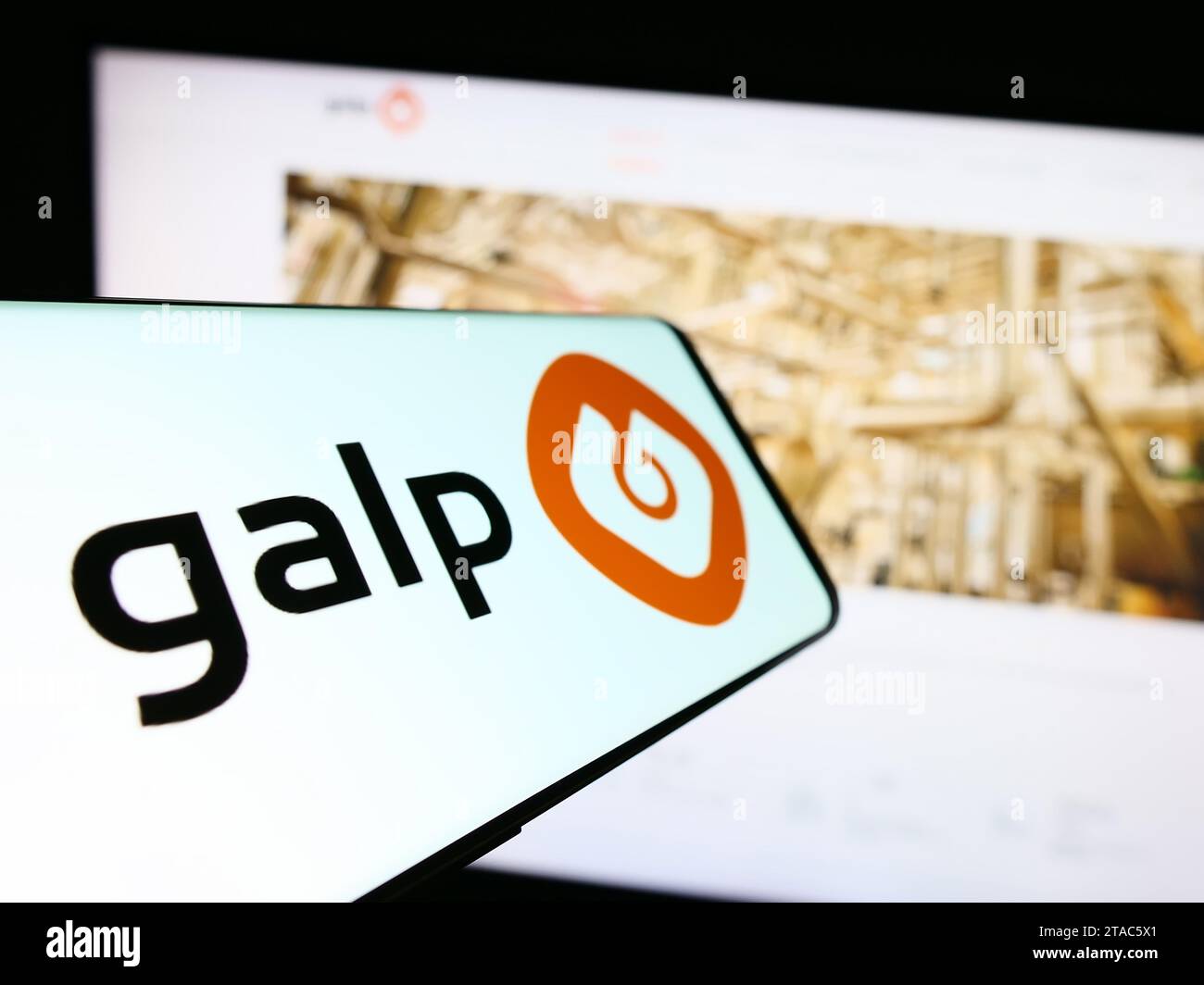 Mobile phone with logo of Portuguese energy company Galp Energia SGPS S.A. in front of business website. Focus on center-left of phone display. Stock Photo