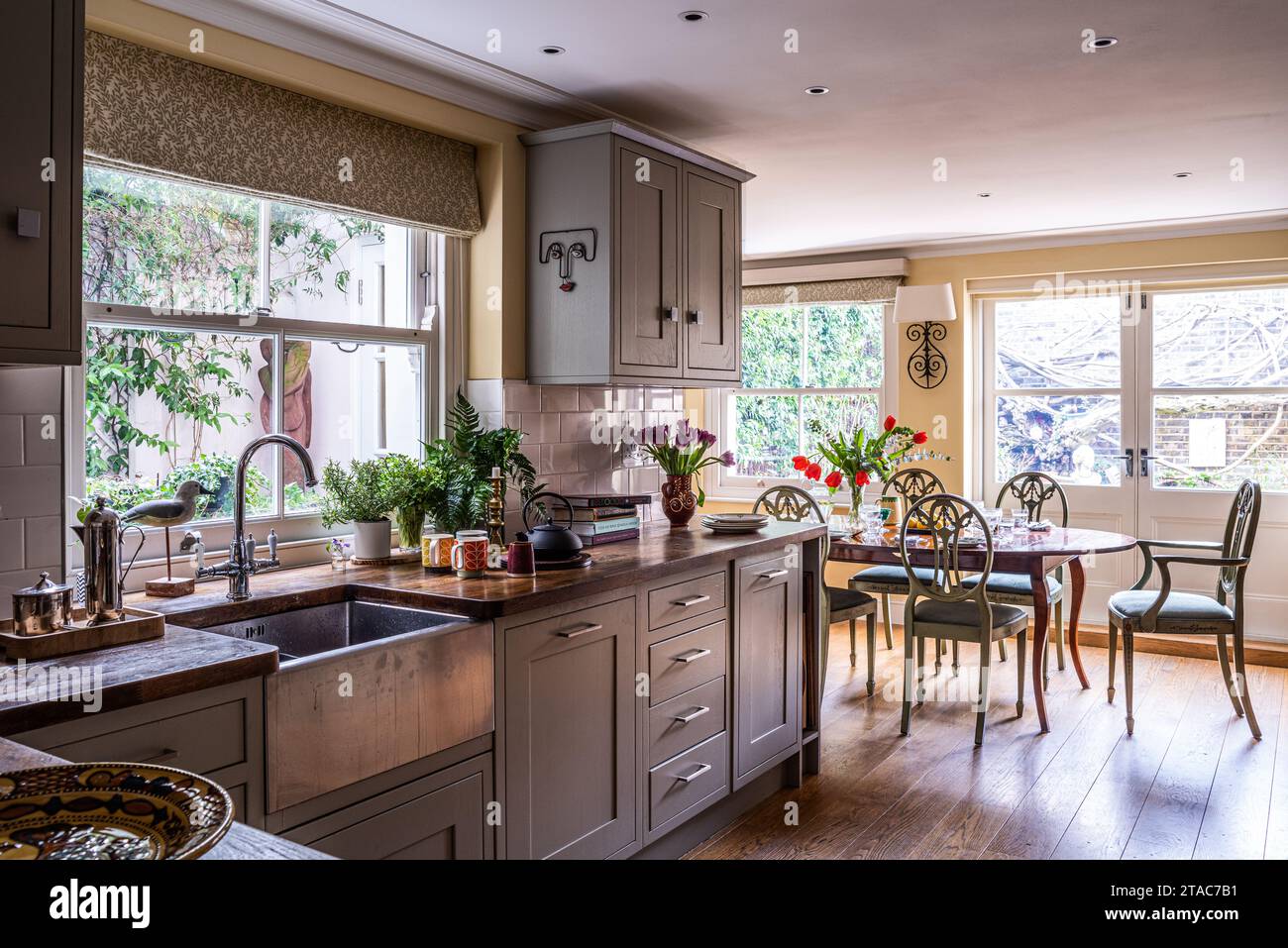Butler sink in renovated kitchen-diner of late 19th century West London home. Stock Photo