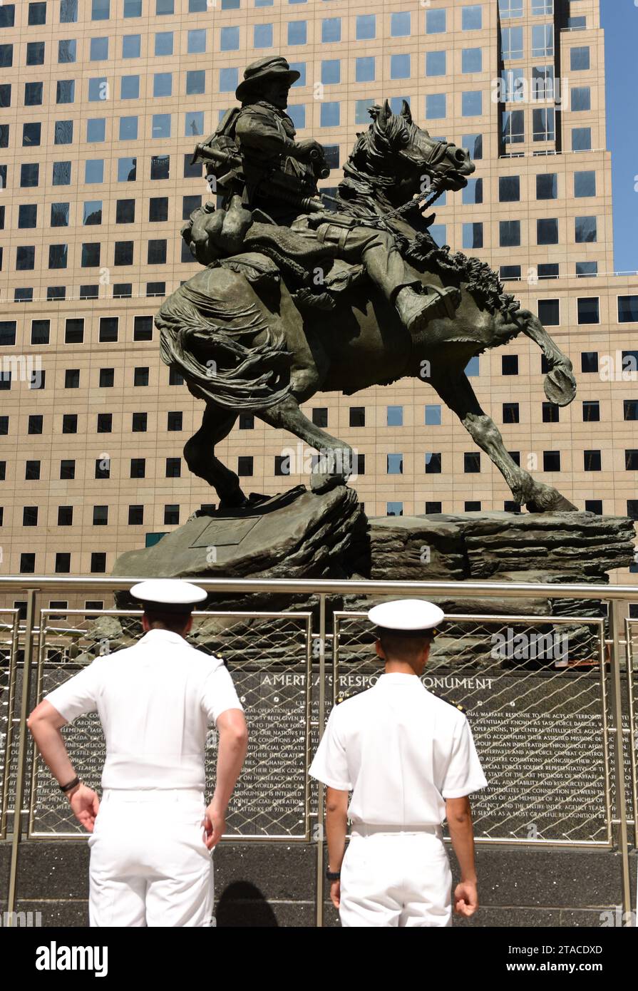 New York, USA - May 24, 2018: US Navy sailors during visiting the America's Response Monument in Liberty Park near NYC 9/11 Memorial in New York. Stock Photo
