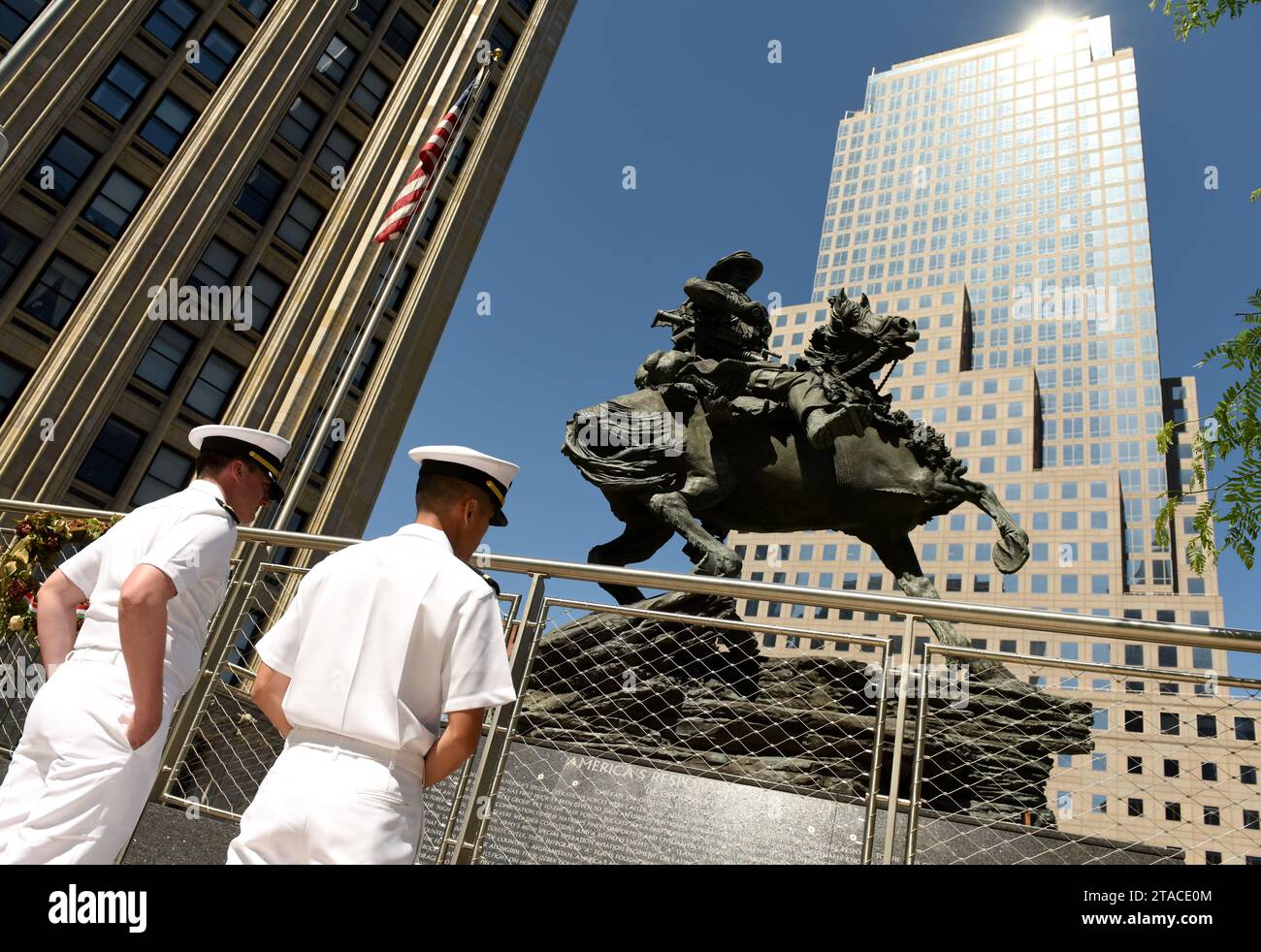 New York, USA - May 24, 2018: US Navy sailors during visiting the America's Response Monument in Liberty Park near NYC 9/11 Memorial in New York. Stock Photo