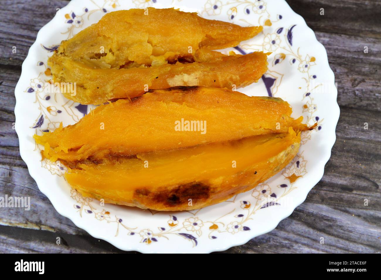 The sweet potato or sweetpotato (Ipomoea batatas), a dicotyledonous plant that belongs to the bindweed or morning glory family, Convolvulaceae. Its la Stock Photo
