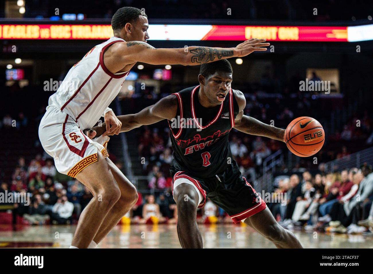 Eastern Washington Eagles forward Cedric Coward (0) is defended by USC Trojans guard Kobe Johnson (0) during a NCAA men’s basketball game, Wednesday, Stock Photo