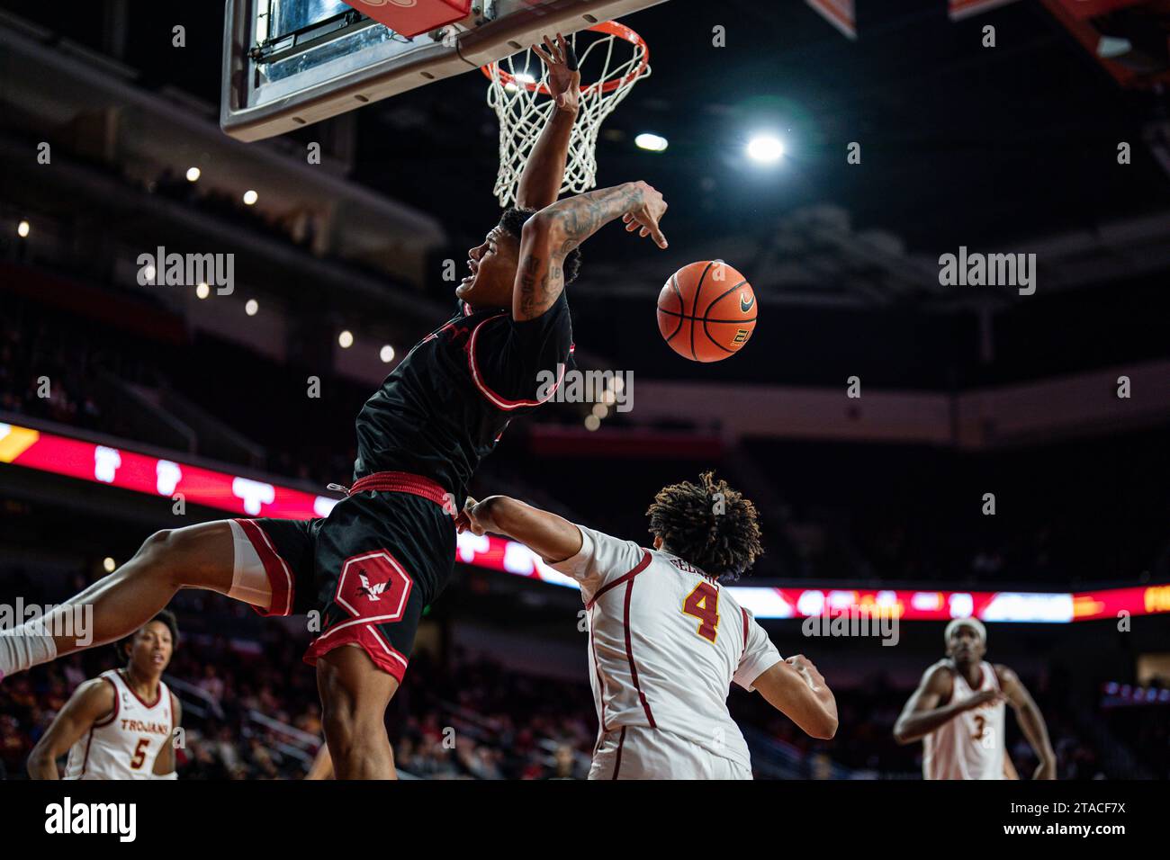 Eastern Washington Eagles forward LeJuan Watts (4) is fouled by USC ...